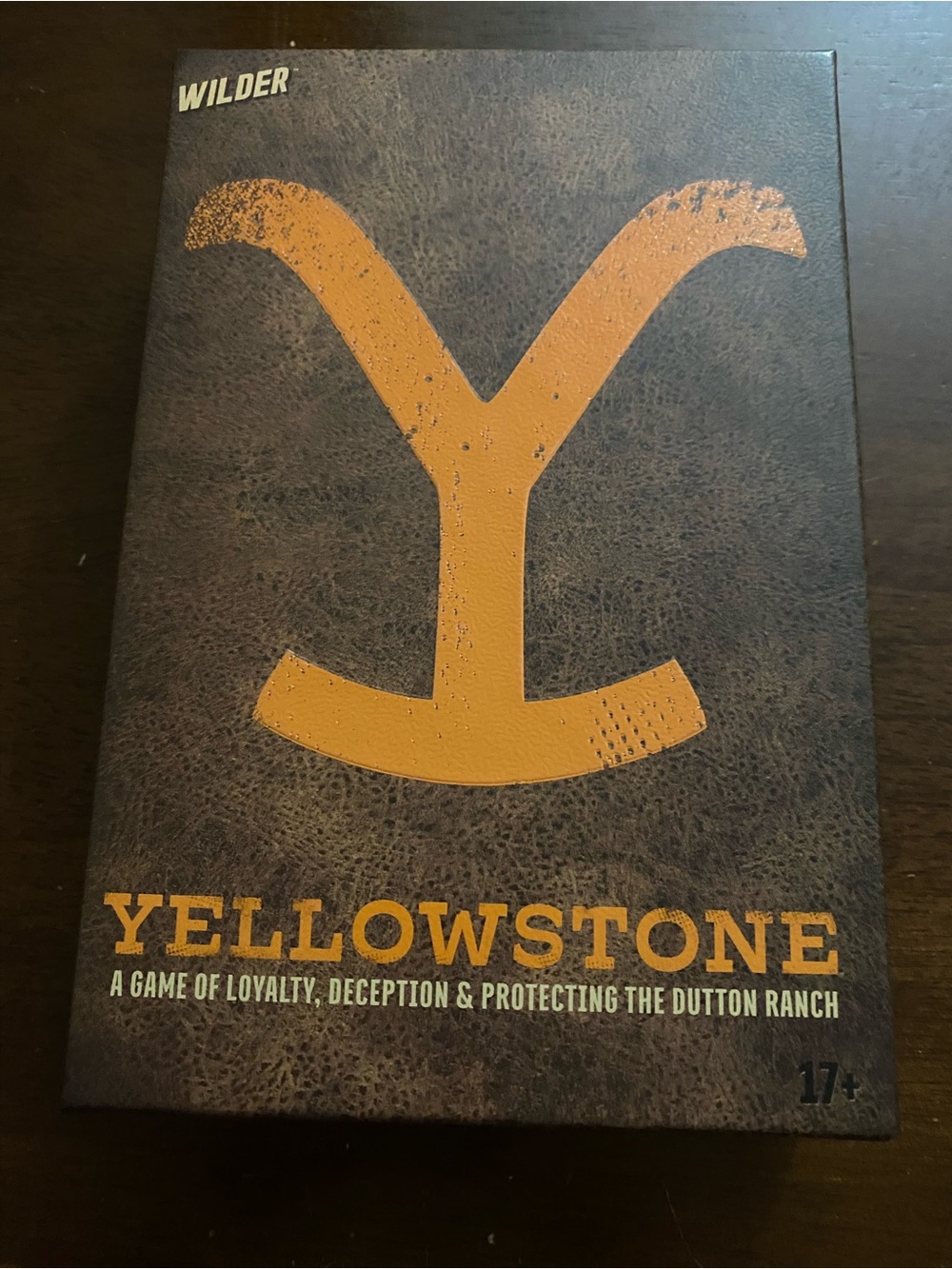 Yellowstone Board Game - Bold Mustard Logo on Brown Box